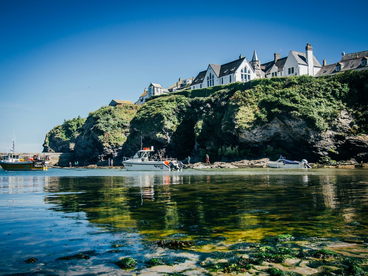 Sunny Port Isaac bay with houses